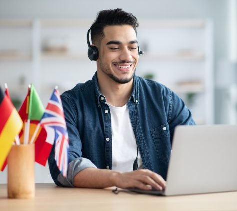 Happy arab guy student learning foreign language online